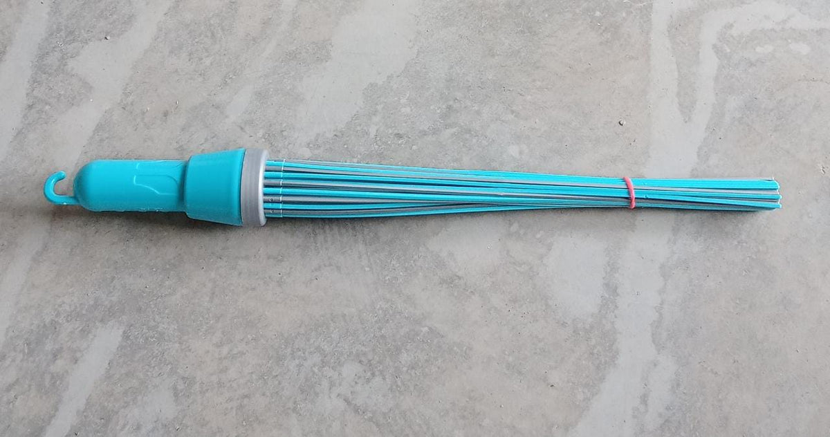 Plastic broom for effective cleaning, highlighting its stiff bristles and base.