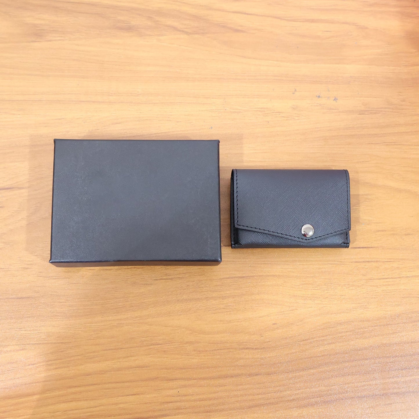 Secure snap closure compact multi-card wallet with sleek textured finish