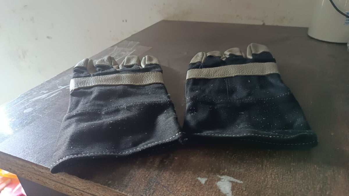 Person using BraveVault leather gloves for various outdoor tasks.