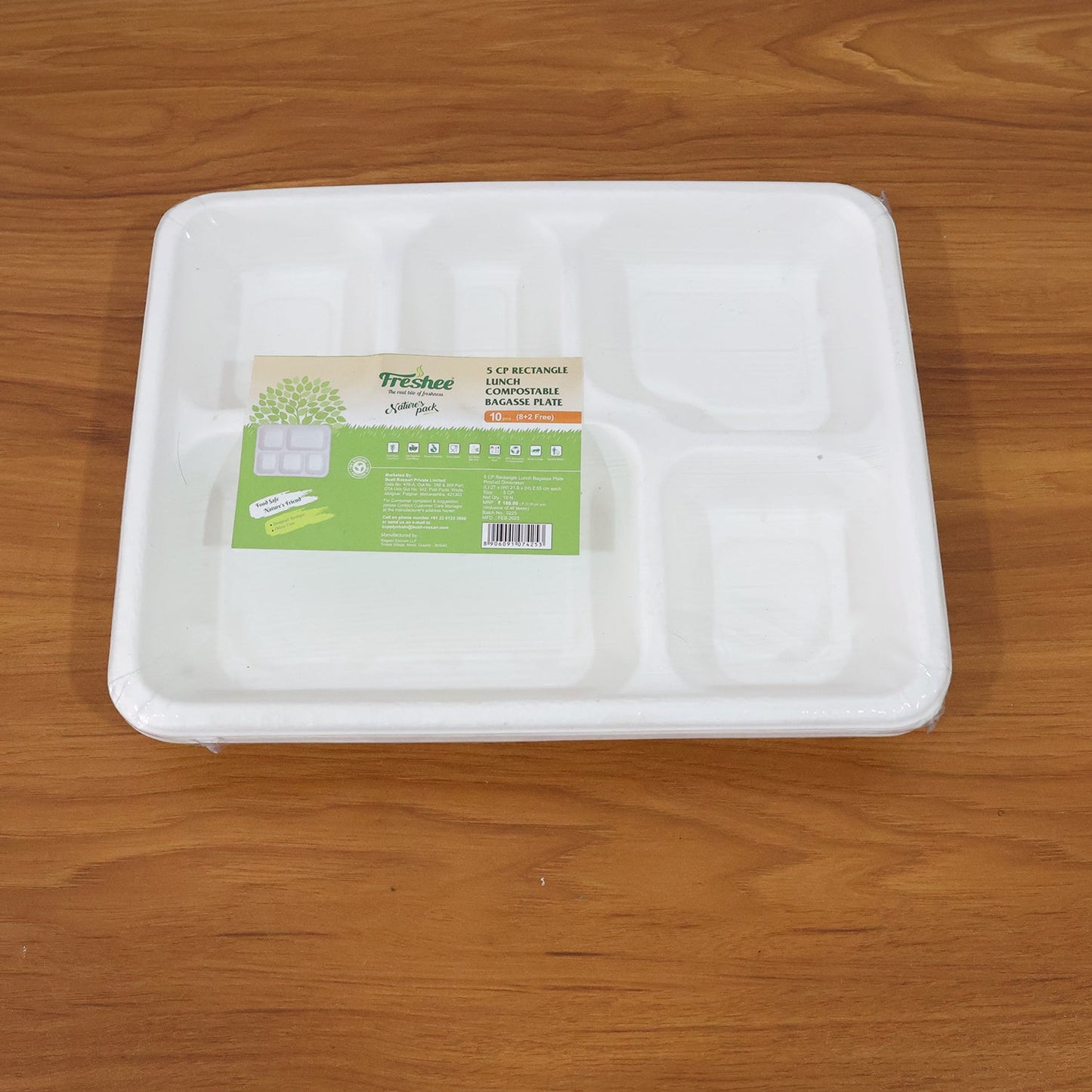 Meal served on compostable 5-compartment bagasse plate for eco-friendly dining