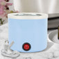 Compact electric wax heater with melting pot, ideal for home hair removal.