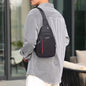 Waterproof crossbody bag in black and grey, worn across the chest.