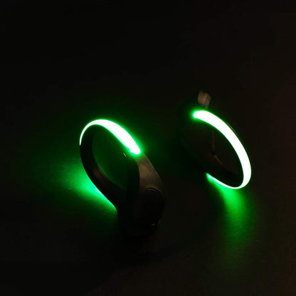 A pair of LED shoe clip lights, showcasing their compact design.
