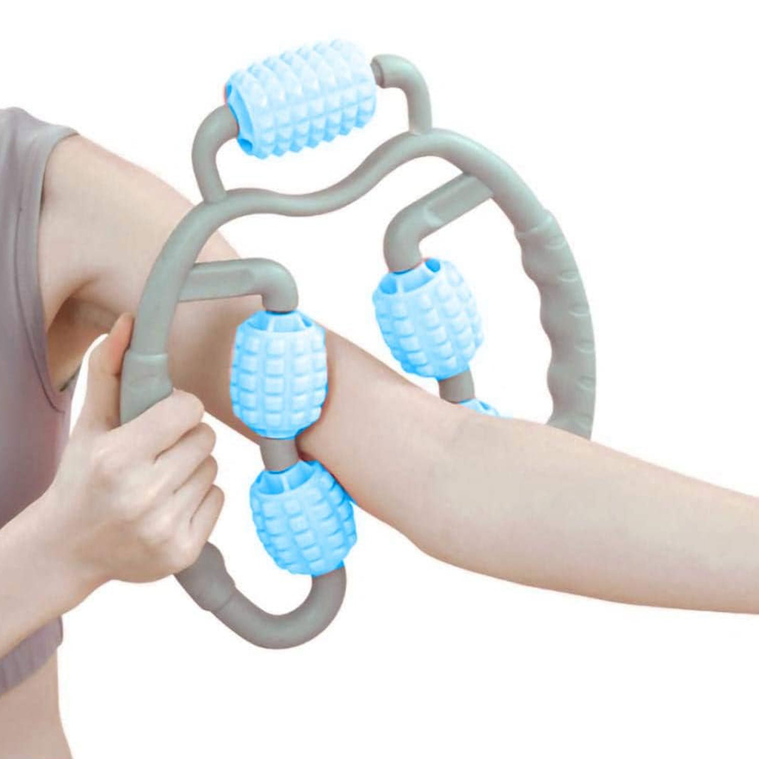 The 5-wheel muscle massage roller laid flat, ready for use on various body parts.