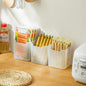 A set of three clear plastic drawer organizers shown neatly arranged in a drawer.