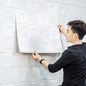 Self-adhesive 3D foam wallpaper panel in a stylish square design.