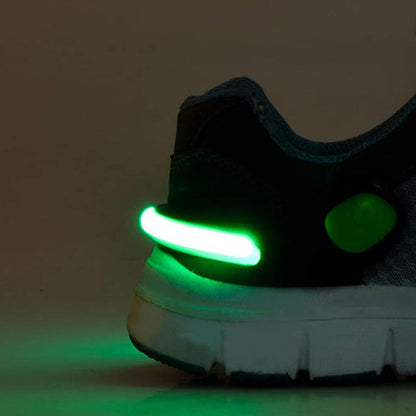 Assortment of vibrant LED shoe clip lights in various colors.
