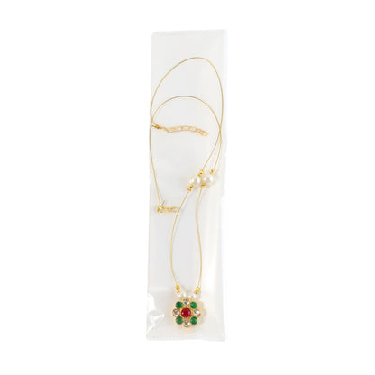 Close-up of the multicolor stone floral pendant on the lightweight pearl chain