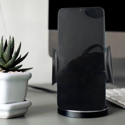 A smartphone securely mounted in the PHOBIA Car Vent Mobile Holder inside a car.