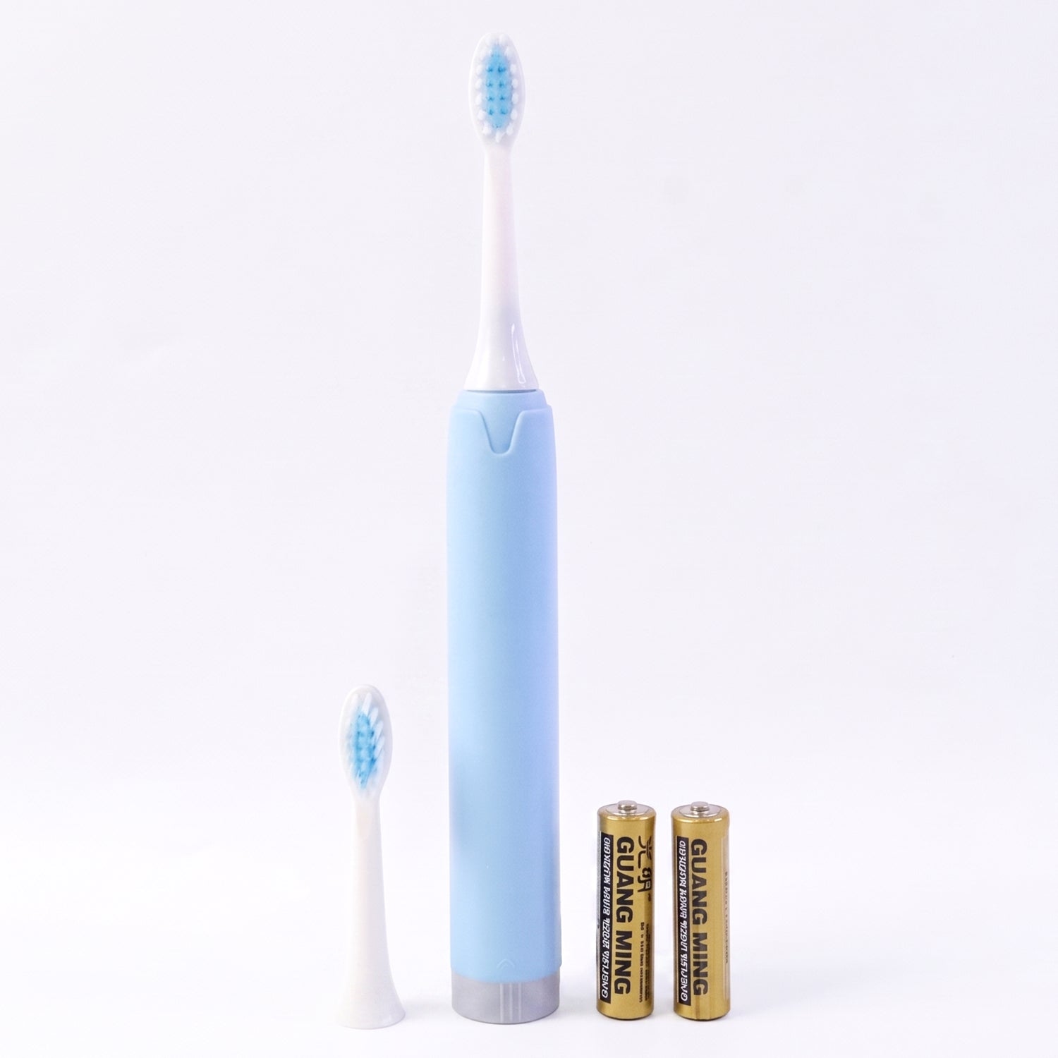 Electric sonic toothbrush on white background with extra head