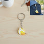 Cute banana shape cartoon keychain with smiling face and metal ring