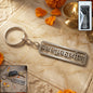 Krishna engraved metal keychain with spiritual design