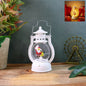 Mini Santa LED lantern glowing with warm light on a wooden surface.