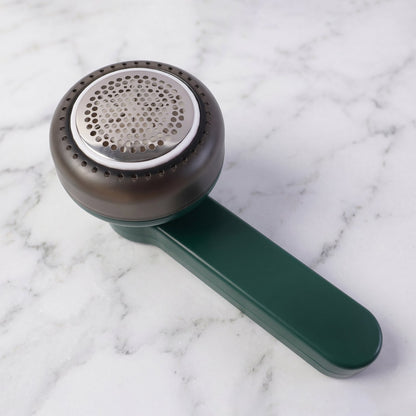 Side view of handheld lint remover