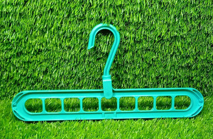 Single multi-functional clothes hanger demonstrating its vertical hanging option.