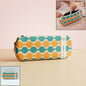 Front view of stylish multi-color geometric printed pencil pouch